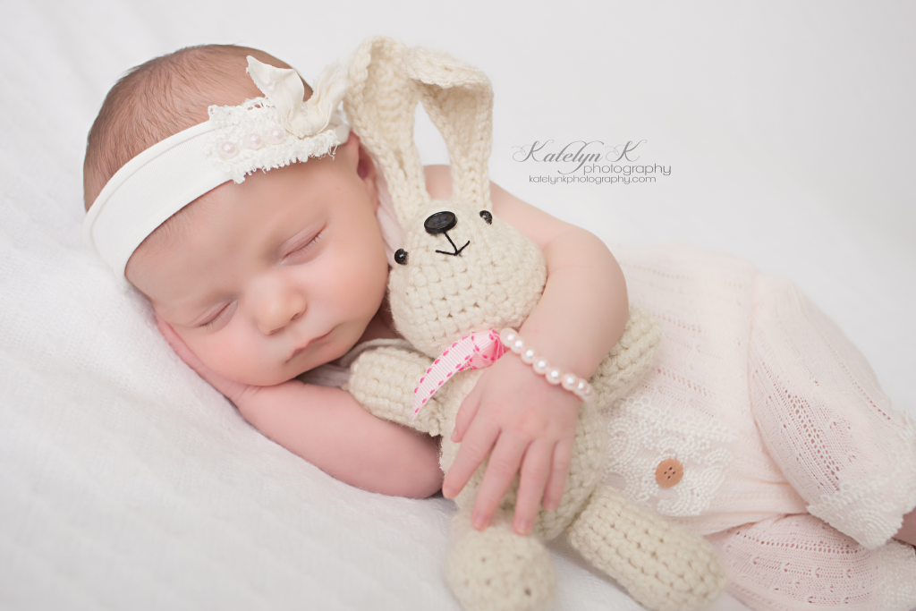 Newborn Baby Girl with Bunny and Pearl Bracelet