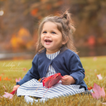 baby with fall leaves